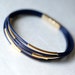 Dark Blue Leather Bracelet with 6 Golden tubes by pardes israel