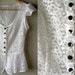 Feminine White Lace Flutter Sleeve PEPLUM Silhouette Vest / Top Hand Stiched 3D Flowers and Black Buttons / Handmade by BlumArt / size S