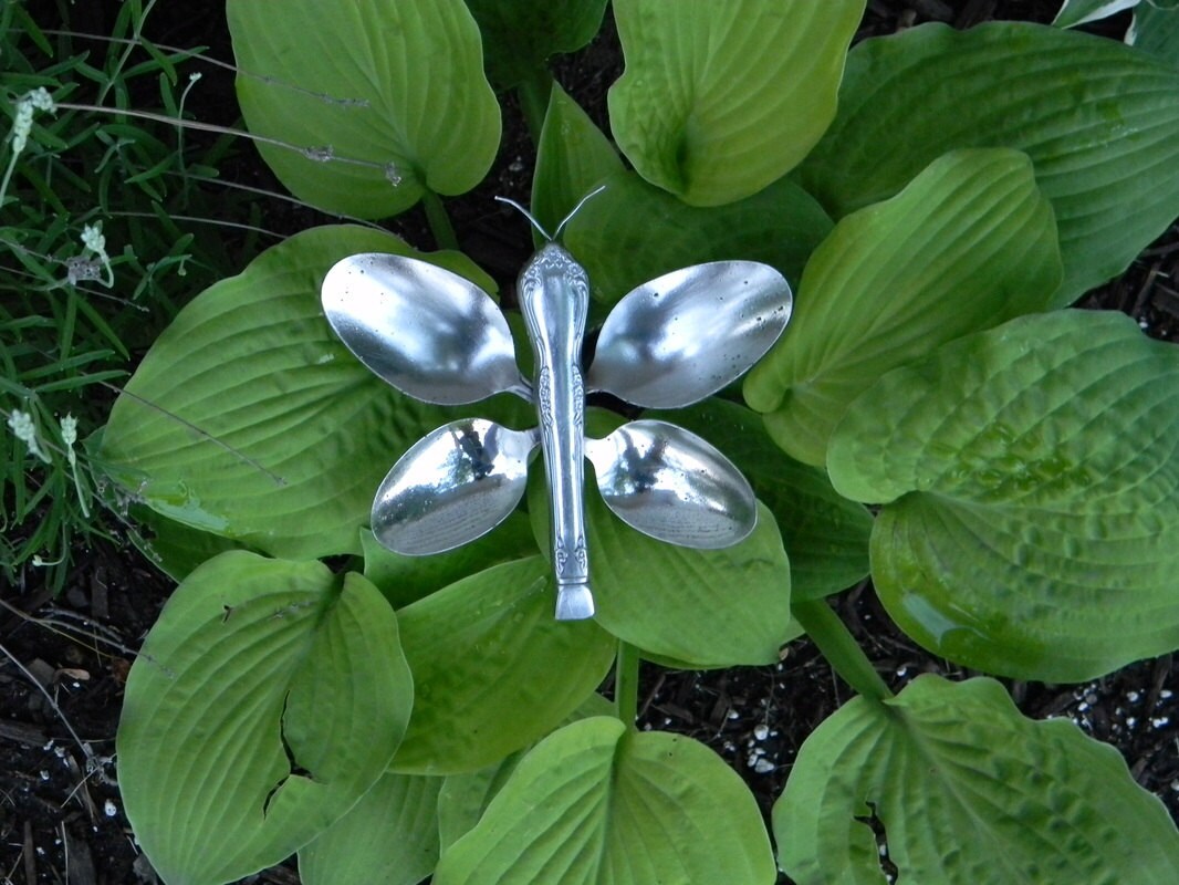 Butterfly garden art made from recycled silverware.