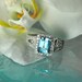 Stunning Emerald Cut Blue Topaz And White Topaz Princess Style Ring