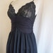 Slinky black slip with lace bodice, ruched torso and full skirt, size Small.