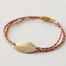 Gold Tone Leaf Braided Bracelet - Blue, Coral & Gold
