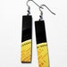 geometric recycled vinyl record earrings. long earrings. black and yellow earrings. one of a kind jewelry. colorful earrings. minimalist.