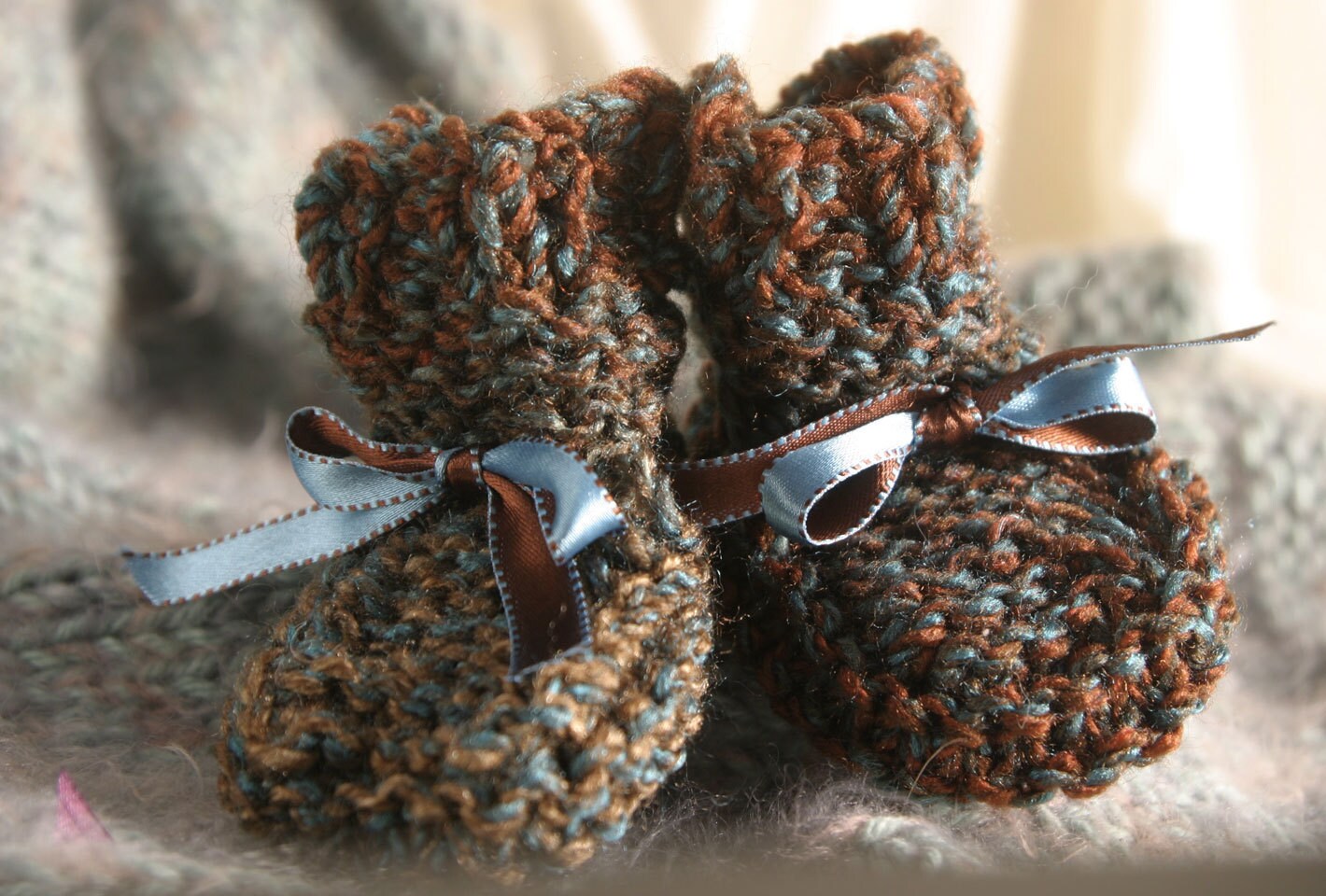 multicolored hand knitted baby booties