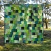 Green handmade lap quilt charm squares zigzag quilting monochromatic
