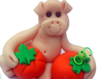 Halloween pig holding two pumpkins