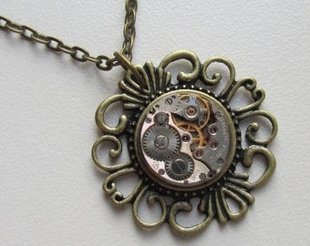 Steampunk Gothic filigree necklace with the smallest vintage watch movement. Gift under 25 Dollars, bronze necklace