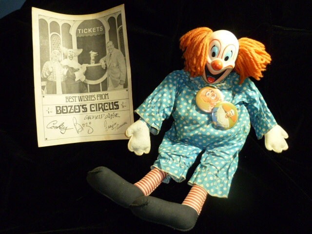 Bozo doll wearing Bozo and Cookie buttons with autographed