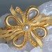 signed Kirks Folly 12K gold plated faux pearl barrette