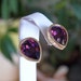 signed Swarovski purple pear shaped earrings in 12K plated gold