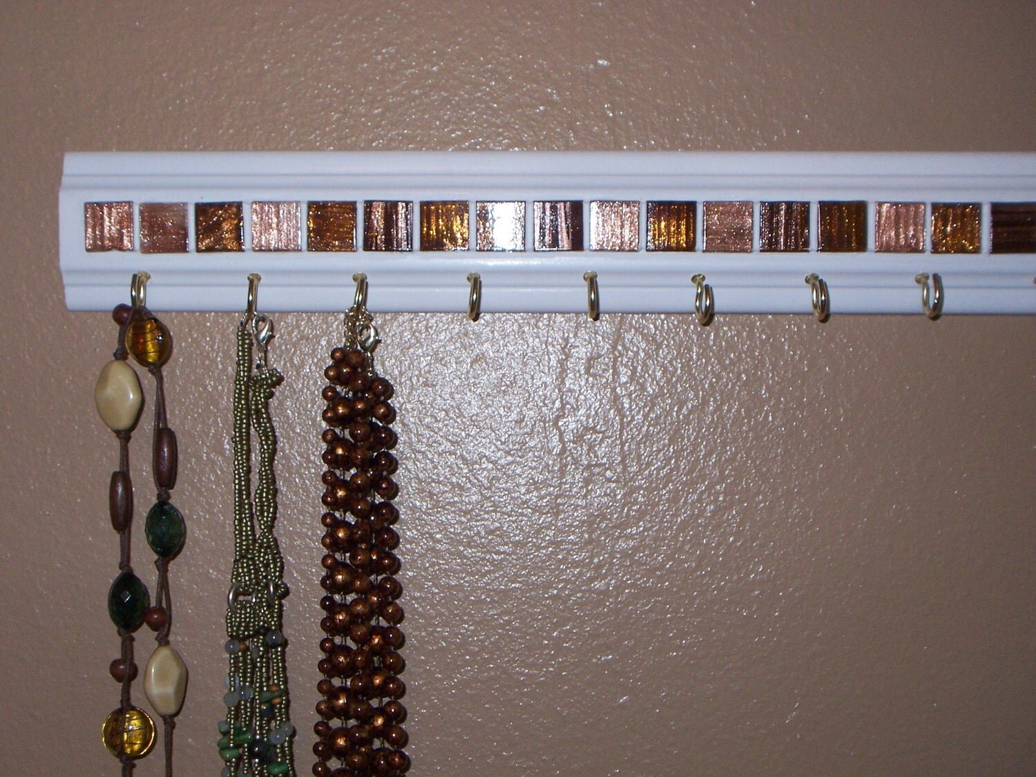 Jewelry/necklace organizer pink/rose colored wall by Gotahangup