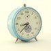 Vintage blue alarm clock made in Russia