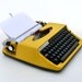RESERVED FOR JOHN Vintage yellow manual typewriter