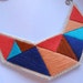 Summer fashion bib necklace embroidered geometric triangles in beautiful blues coral peach and tan colors dramatic design