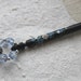 Painted Lace Bobbin - spiral of Daisies and Forget-me-nots on Ebony