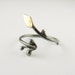Branch . Adjustable ring . Oxidized silver and brass