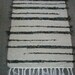 Handmade loom woven rag rug tan and black striped South Dakota made