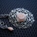 Gentle filigree pendant with pale pink rose.