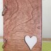 staind wood journal with heart cut out