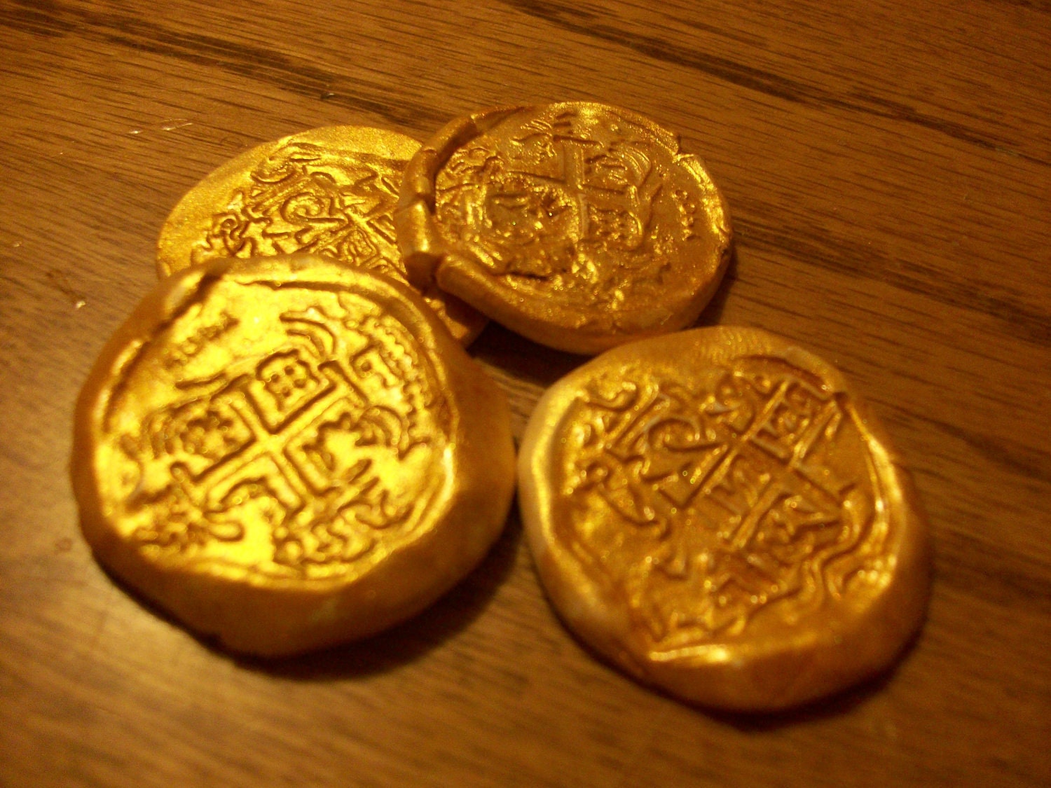 clay pot with gold coins and an old manuscript