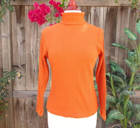 bright orange turtleneck
