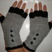 Hand-knitted grey and black color women fingerless gloves with buttons