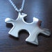 REDUCED TO CLEAR Silver Puzzle Piece Pendant Necklace