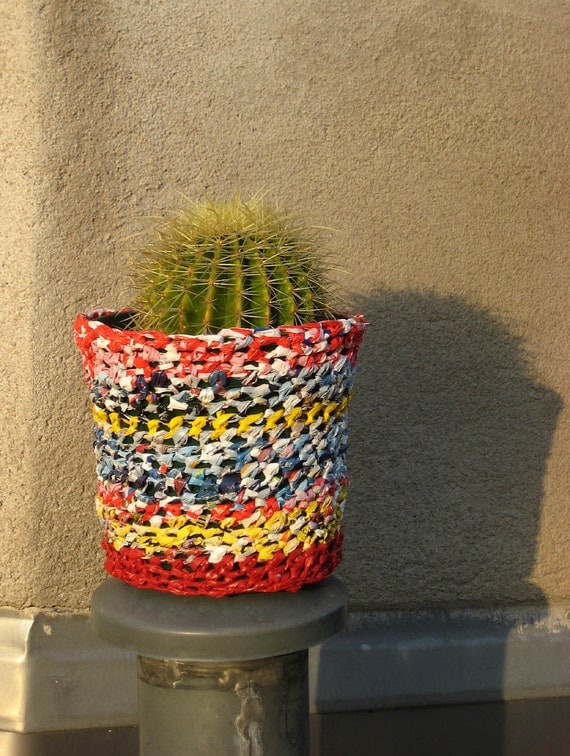 Items similar to Planter with plarn coat, flower pot, recycled ...