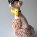 pink spaghetti poodle figurine