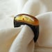 Wooden ring with natural honey baltic amber Unique jewelry Wood in black colors and stone