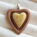Heart Pendant made of natural yellow baltic amber and wood Artistic Jewelry