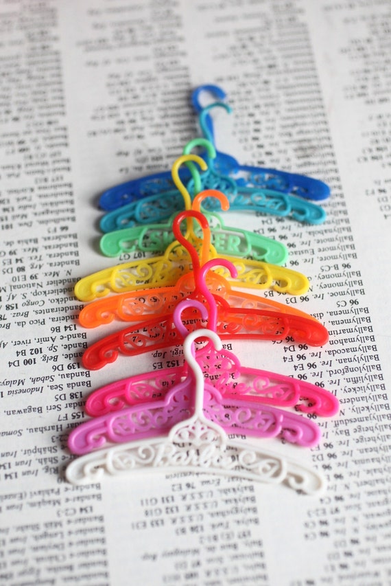 Lot of 9 Vintage Barbie Doll Clothes Hangers in every color