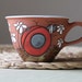 Cappuccino cup with ladybird, daisies / flowers motif