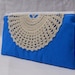 Teal blue pouch with vintage lace doily accent