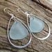 Sea glass jewelry, Pale blue sea glass dangles within sterling silver teardrop earrings