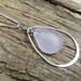 Sea glass jewelry, Pale purple sea glass suspended in sterling silver teardrop pendant