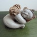 Vintage ceramic figure sleeping small angel marked
