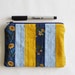Small zipper pouch. English garden inspired quilted pouch. Small clutch. Make up bag. Patchwork bag with sunflowers and polka dots