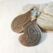 Copper earrings paisley.