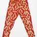 Hand Printed Kids Leggings in Gold on Rust 'Faces' Print