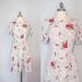 Vintage dress. Swing dress. White with red, purple and navy flowers. Size L/XL.