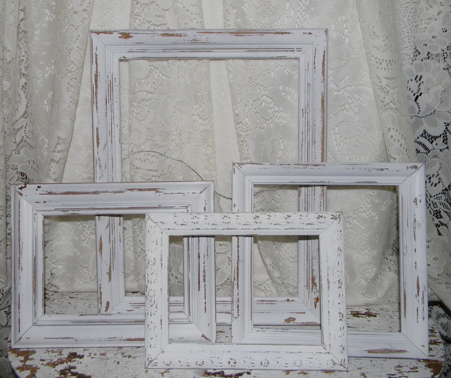 distressed white picture frames        
        <figure class=