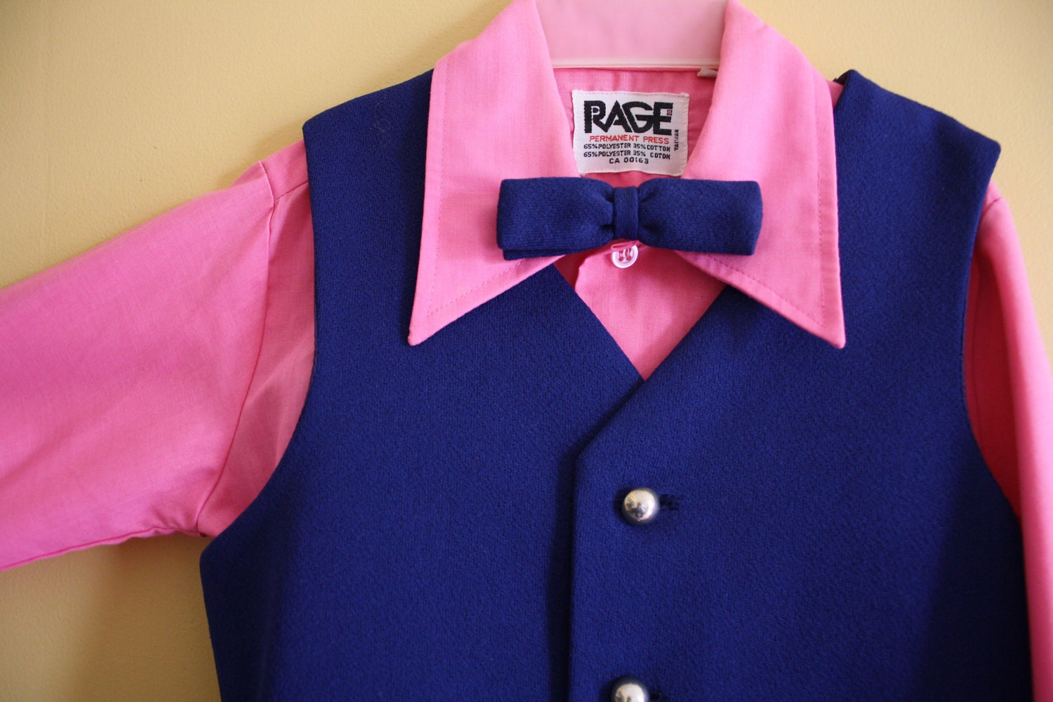 blue vest pink shirt