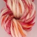 Fruity swirl meringue. Hand painted hand spun thick and thin. Superwash merino Art yarn