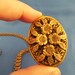 Gold tone Flower perfume locket and detailed chain.(N54)