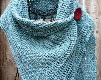 Turquoise buttoned wrap with a big red button. Very soft and