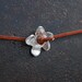 Metal flower necklace with brown leather cord. Zamak flower choker. Adjustable knotts. NL002