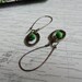 Antique Gold Hammered Ring with Green Glass Bead Dangle Earring on Antique Gold Kidney Loop Jewelry