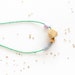 BEADED ABACUS NECKLACE / sliding mixed-media beads in grey porcelain & lilac polymer w/ geometric wooden geode on green beaded chain
