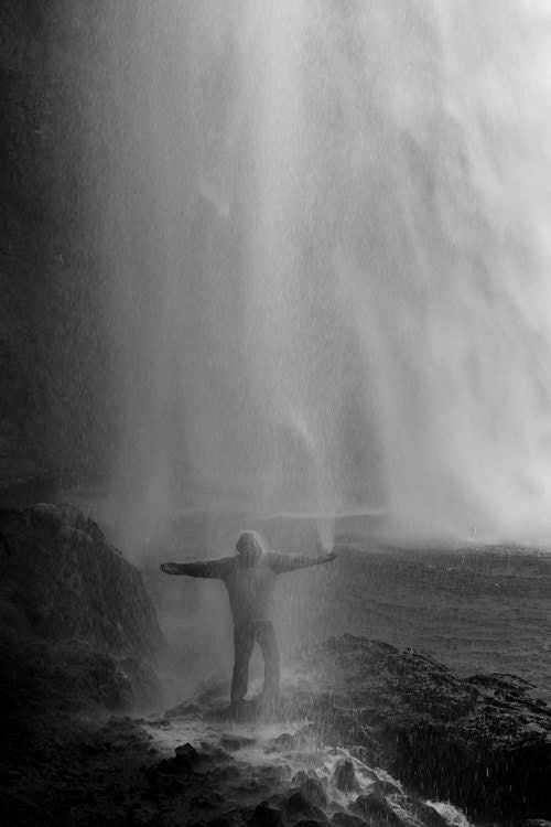 Man Under Waterfall